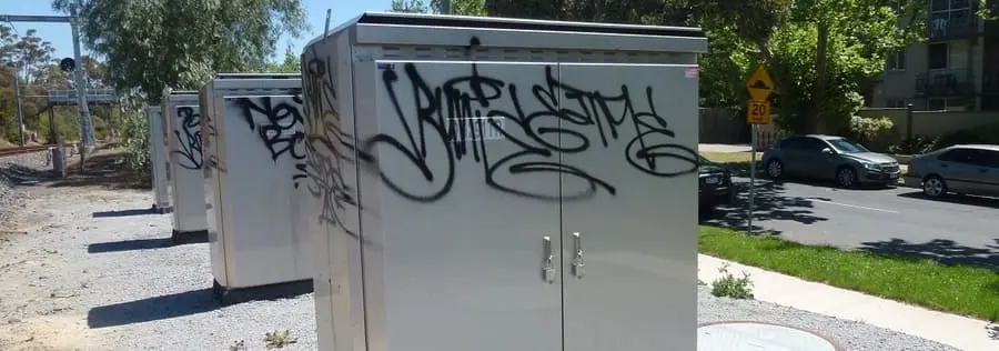Graffiti on metal utility cabinets.