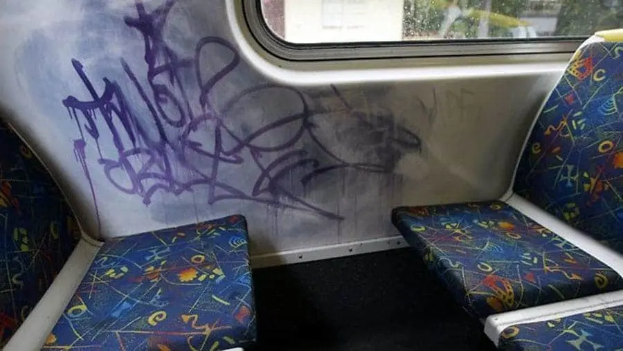 Graffiti inside a train carriage.