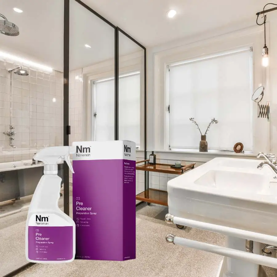 Pre Cleaner spray bottle and box in a bathroom