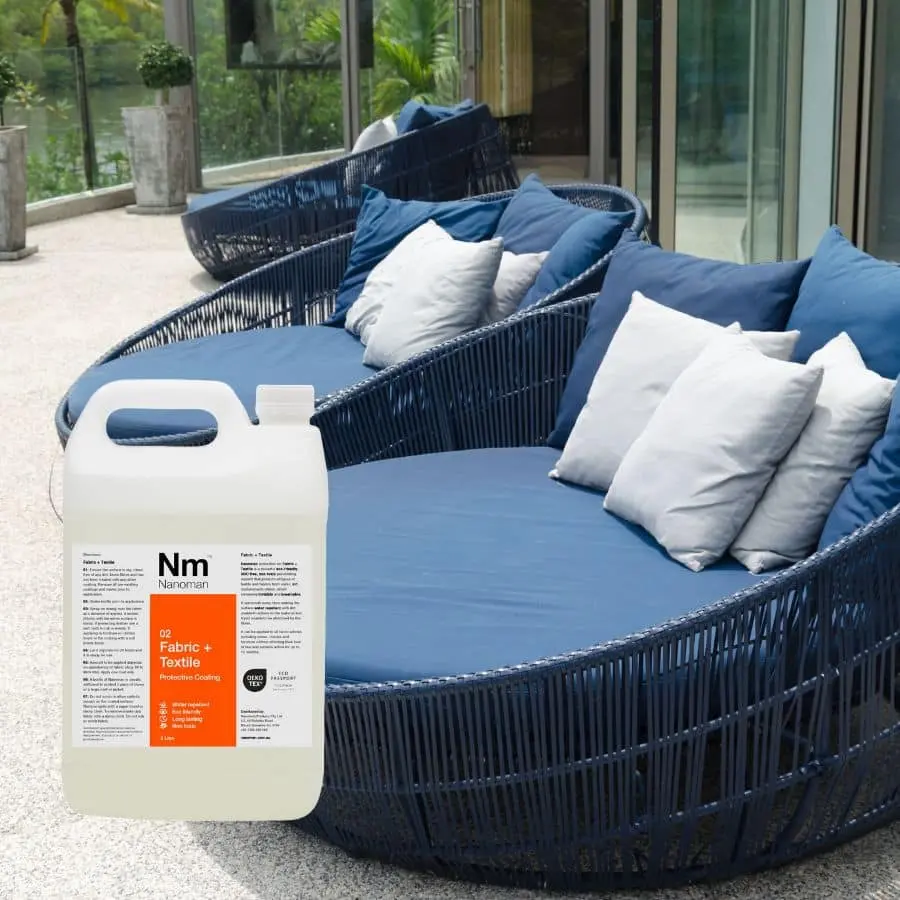 Fabric Waterproofing Spray beside an outdoor sofa with cushions