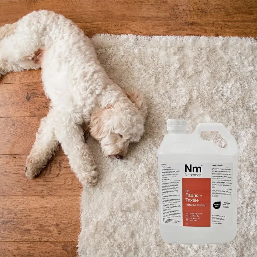 Fabric Waterproofing Spray on a rug with a dog lying on it