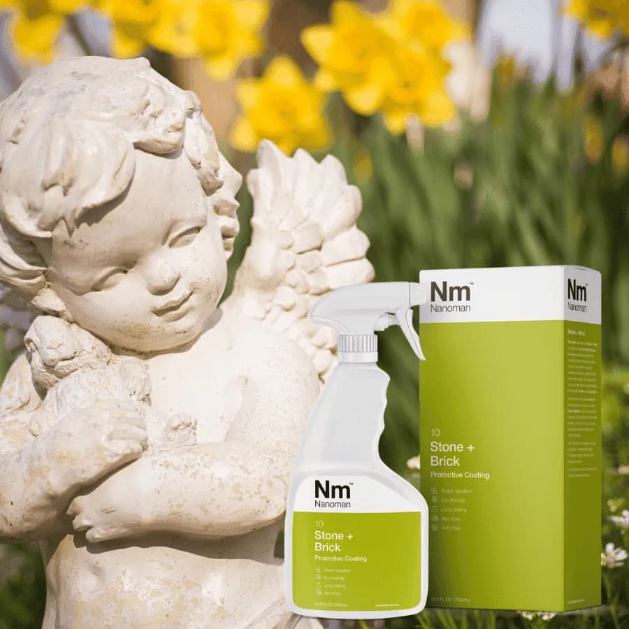 Stone Sealant 750 ml and box beside a stone garden statue