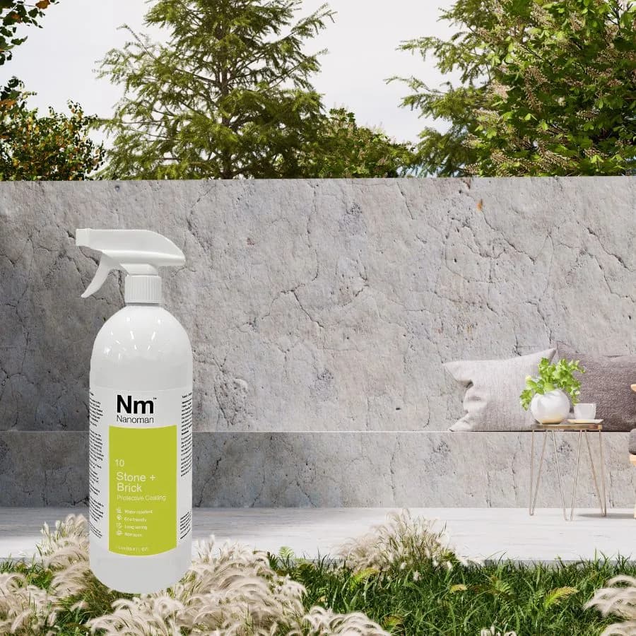 Stone Sealant 1 L in front of a concrete garden wall