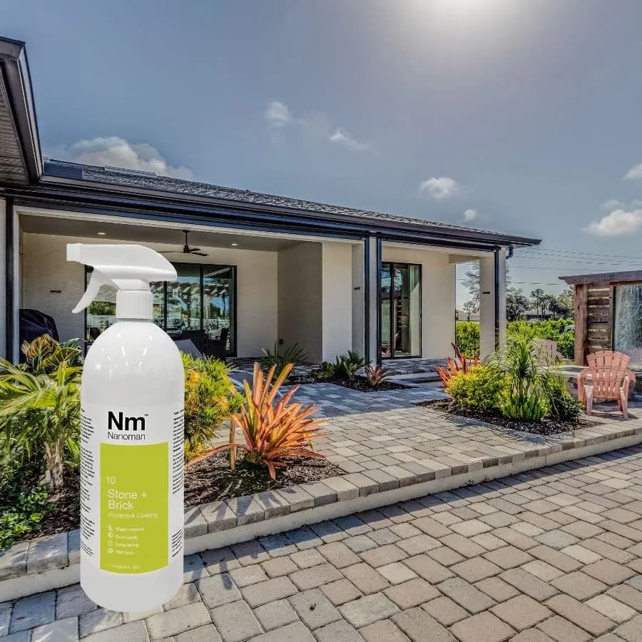 Stone Sealant 1 L on paving stones in front of a house