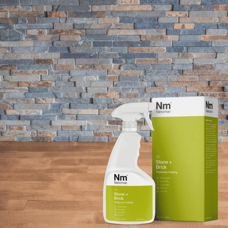 Stone Sealant 750 ml and box in front of a stacked stone wall